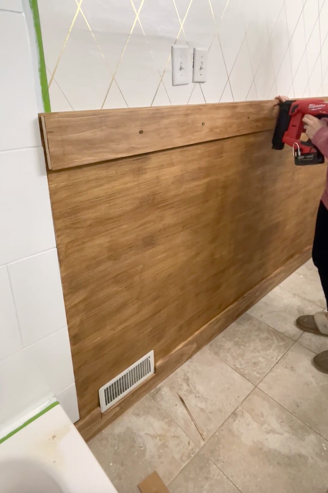 Adding a peg rail to a board and batten bathroom wall. 